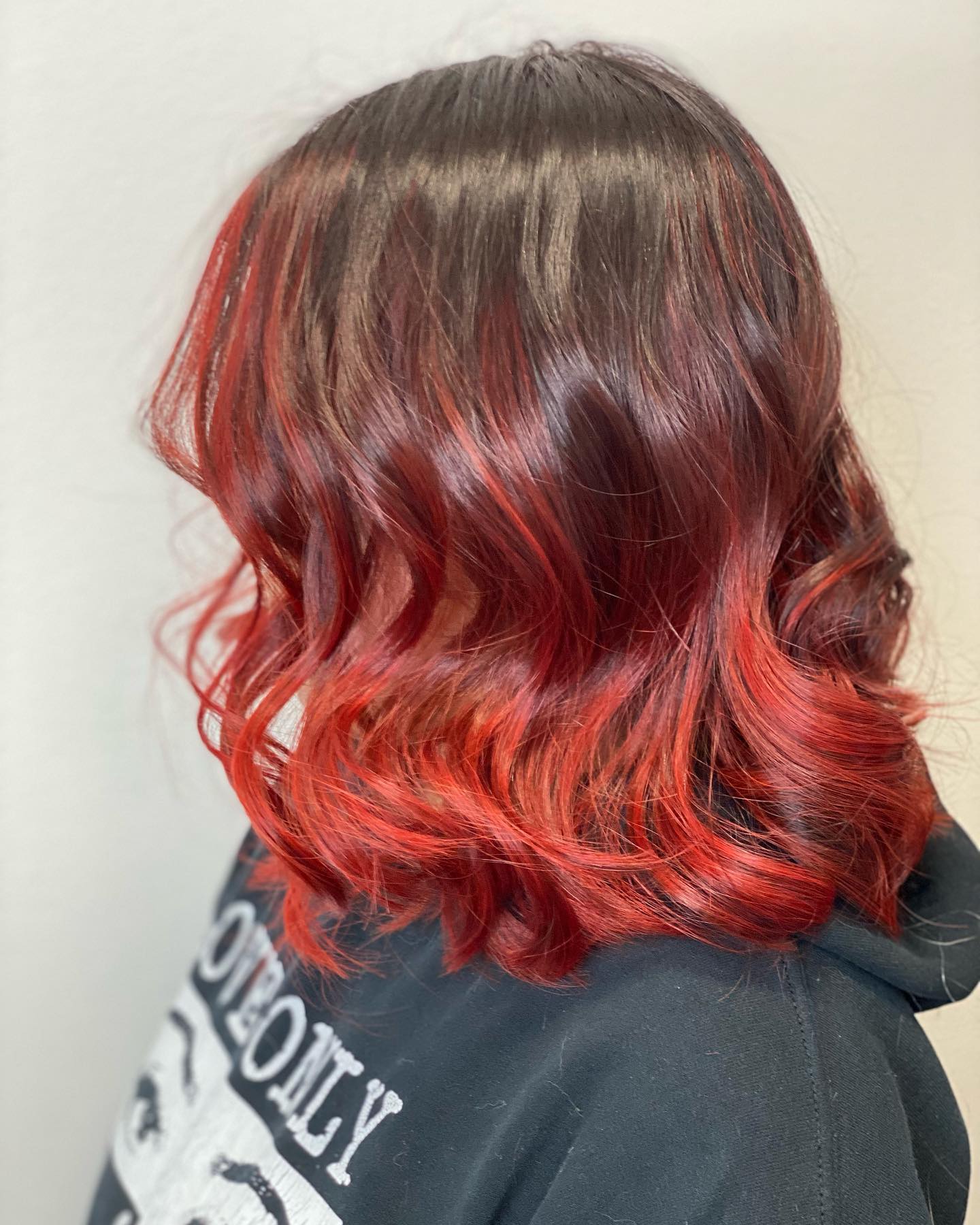 Red ombré bob styled with soft curls